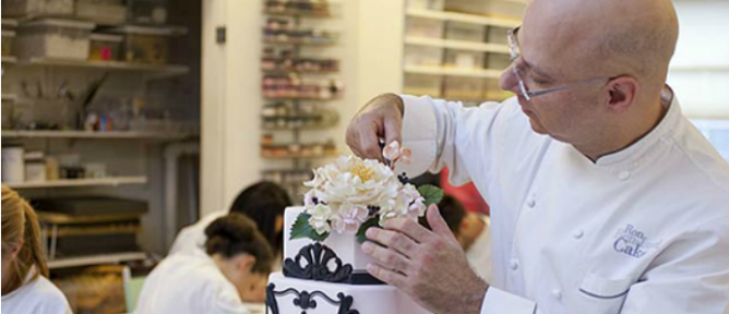 Ron Ben-Israel putting the finishing touches on one of his wedding cakes.