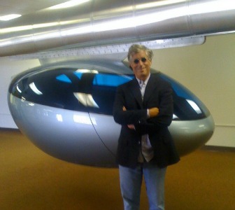 CEO Jerry Sanders with a skyTran module.