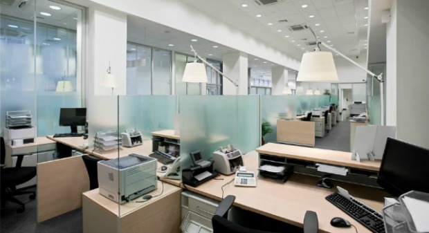 Lights on in empty offices are a big money waster. Image via Shutterstock.