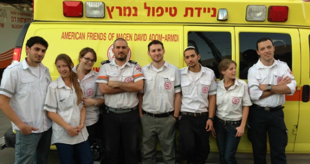 Paramedics-in-training from Ben-Gurion University of the Negev aren’t in class during the conflict, so they are volunteering with the local ambulance squad. Coordinator Oren Wacht is in the middle. Photo courtesy of Ben-Gurion University