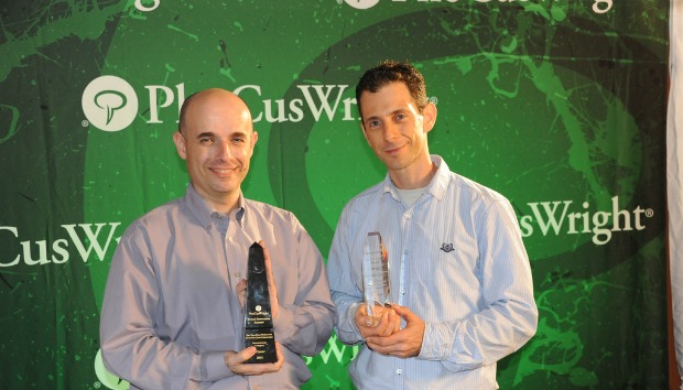 Evature's Barry Volinskey, left, and Tal Weiss receiving the DEMO award for the most game changing travel innovation at the PhoCusWright 2011 Travel Industry Summit.