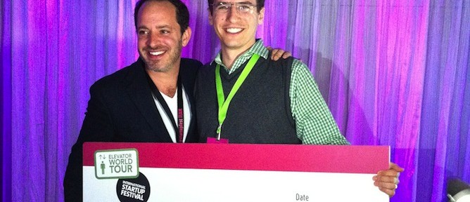 MobileOCT CEO Ariel Beery, right, receives $100,000 investment prize from Philippe Telio, founder and producer of the International Startup Festival and Elevator World Tour.