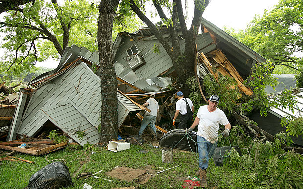 IsraAID volunteers help with removing debris from damaged houses in the Wimberley, Texas area. (photo: IsraAID)